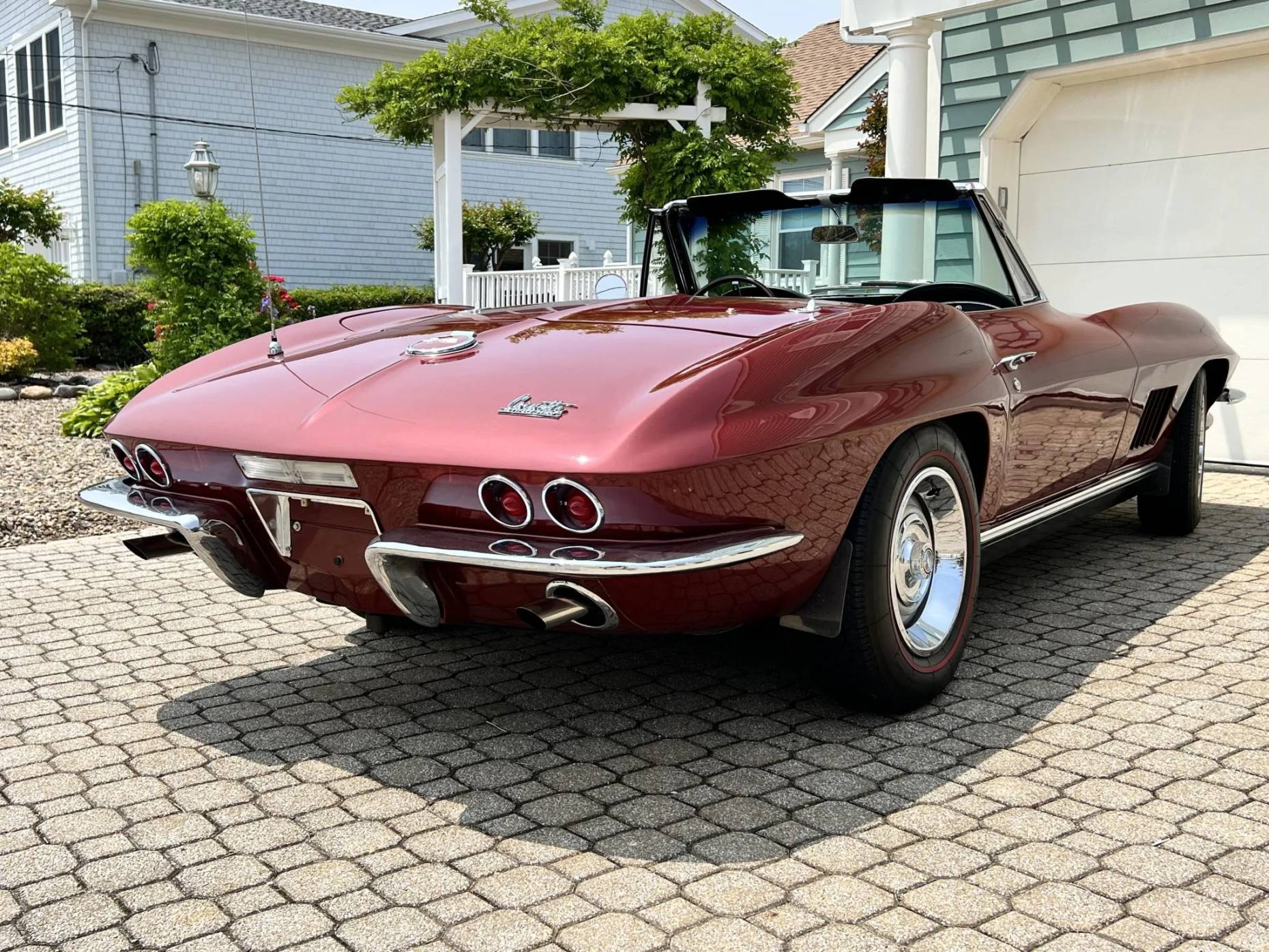 Right rear 3q view of a maroon 1967 Chevrolet Corvette convertible with the top down
