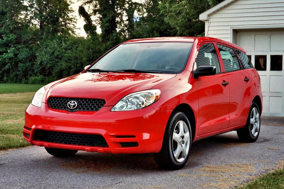 A red 2003 Toyota Matrix parked in a driveway