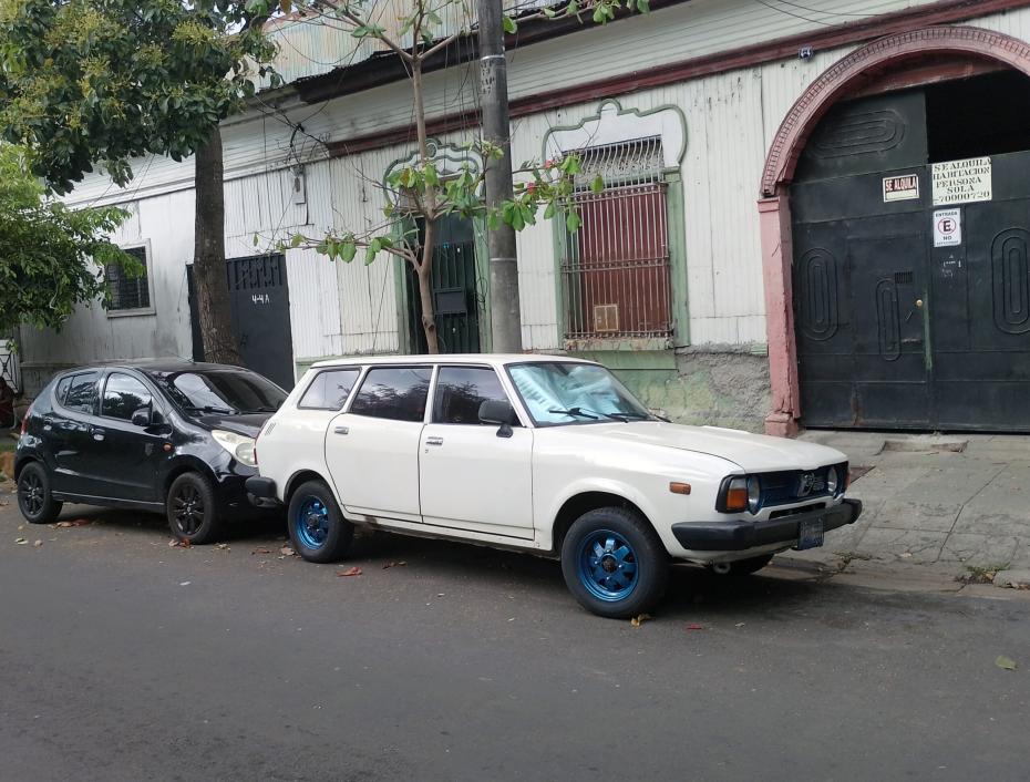 Photo of a well-preserved white 1978 Subaru Leone station wagon parked on the street